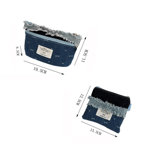 Denim makeup bag set with white bow embroidery and dimensions for storage pouch