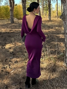 Detail of elegant deep purple backless dress with draped cowl neckline and satin finish