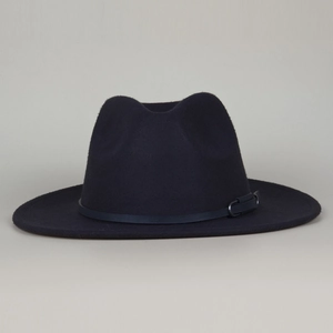 Detail of wool felt fedora hat featuring a navy leather band and metallic buckle
