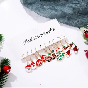 Christmas earrings set with Santa, tree and sock designs on festive background