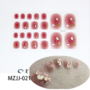 Detail of dark red gradient toe nail stickers with gold foil and shell embellishments