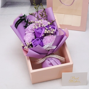 Pink gift box with purple soap rose bouquet, carnations, and matching greeting card
