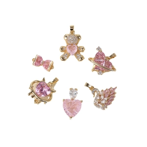 Pink zircon and gold charms set featuring bear, swan, and heart designs for DIY jewelry