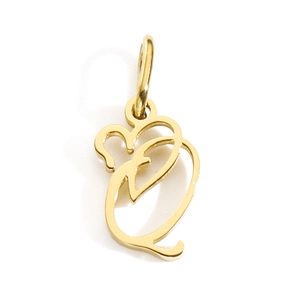 Detailed macro view of a golden polished stainless steel letter Q alphabet pendant