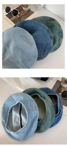 Detailansicht von drei gewaschenen Denim-Baskenmützen in verschiedenen Blautönen