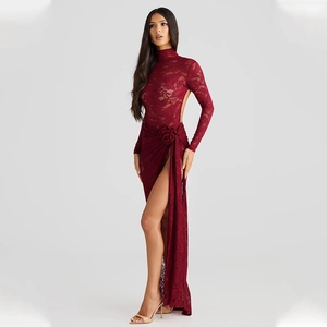 Detail of burgundy lace evening gown featuring high neck, open back, and side slit
