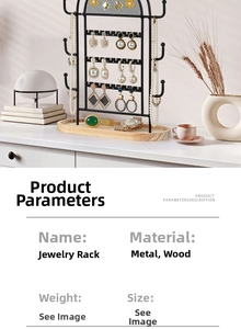 Detail view of tiered black metal jewelry organizer with natural wood base on white shelf