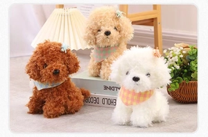 Three plush toy puppies in brown, beige, and white wearing checkered scarves in a home setting