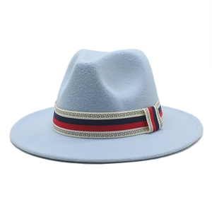 Detail of light blue wool fedora featuring a Greek key pattern ribbon with red and blue stripes