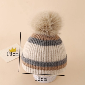 Close-up of winter knitted hat showing striped pattern, pom-pom and 19cm dimensions