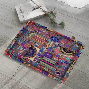 Flat lay of colorful mandala print flannel laptop bag on a rustic wood floor