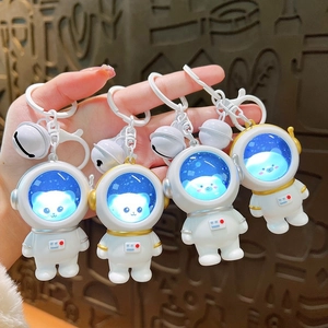 Portachiavi astronauta luminosi con casco a luce blu e campanellini in metallo
