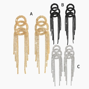 Elegant long rhinestone tassel earrings in gold, silver and black finishes on white background