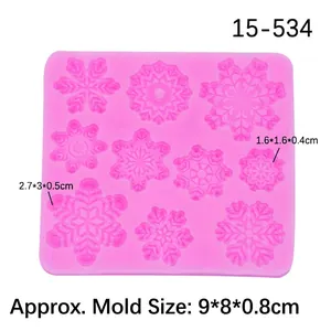 Pink silicone mold with 9 assorted snowflake patterns for fondant cake and chocolate DIY