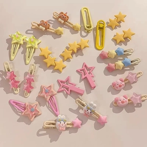 Colorful Y2K star and animal hair clips set for girls on a warm beige background