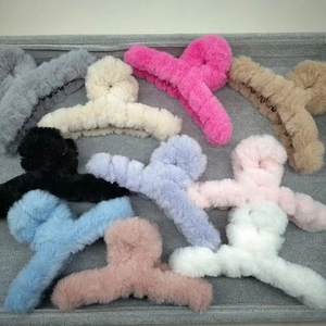 Detailed overhead display of large plush shark hair claws in ten various autumn colors