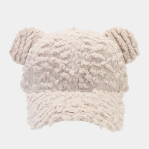 Detail of plush beige baseball cap featuring fluffy faux fur texture and cute round ears