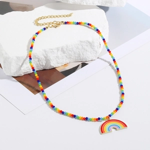 Detail view of handmade rainbow beaded necklace with golden lobster clasp and heart pendant