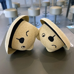 Straw sun hat for children with cute cartoon face embroidery and black ribbon trim