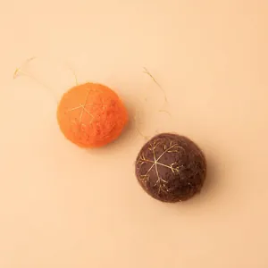 Orange and brown plush wool felt Christmas balls with gold snowflake embroidery and strings