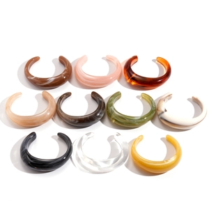Acrylic cuff bracelet set featuring tortoiseshell and marble patterns in vibrant colors
