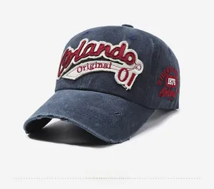 Detail of vintage navy washed baseball cap with Orlando 01 distressed embroidery
