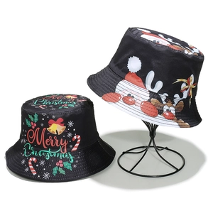 Set of two black Christmas bucket hats with Santa and reindeer prints on a metal stand