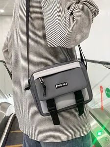Retro grey nylon crossbody bag for men and women featuring buckle closure and adjustable strap