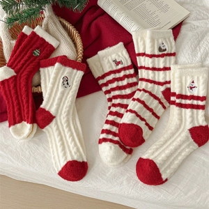 Thick warm Christmas wool socks with festive embroidery in red and white colors