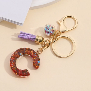 Colorful resin letter C keychain with mixed glitter, purple tassel and golden rings