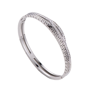 Silver stainless steel bracelet featuring Greek key pattern and sparkling zircons