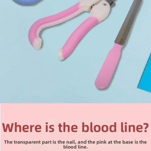 Close-up of pink pet nail clipper and file set with stainless steel safety guard