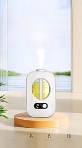 Detail view of smart essential oil diffuser with LED display on a wooden tray