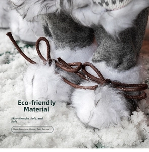 Detailed view of plush Santa doll boots with faux fur and woven brown shoelaces