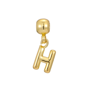Macro detail of 18k gold plated balloon style letter H pendant with polished finish