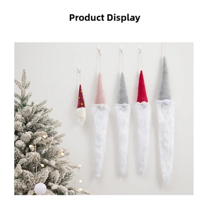 Five assorted Christmas gnome ornaments with long white beards hanging on a white wall