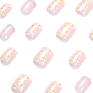 Short square French press-on nails with purple edges and white daisy patterns