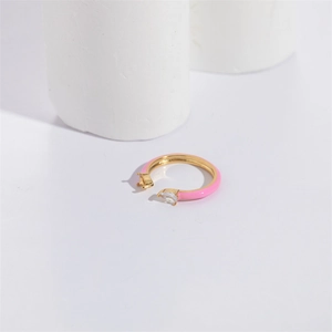 Minimalist gold open ring featuring pink enamel and a pear-cut waterdrop cubic zirconia stone