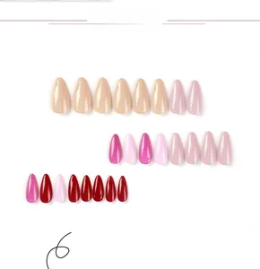 Glossy almond-shaped press-on nails in nude, pink, and burgundy shades shown in detail