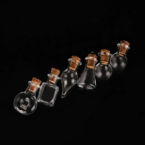 Set of six mini transparent glass jars with cork stoppers for DIY crafts and gifts