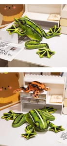 Close-up of realistic green and orange plush frogs with detailed printed skin patterns