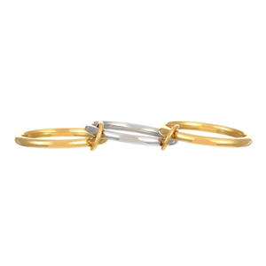 Detail of interlocking minimalist gold and silver stacked rings with mirror finish
