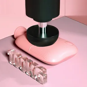 Pink silicone hot water bag under 100kg pressure test showing durable anti-burst feature