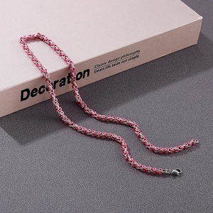 Detailed close-up of pink and silver Byzantine chain link necklace with lobster clasp