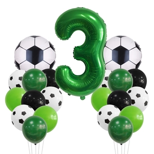 Macro view of green number 3 foil balloon with soccer balloons for birthday party decor