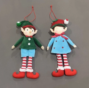 Close-up of red and green felt Christmas elf ornaments with white hanging strings