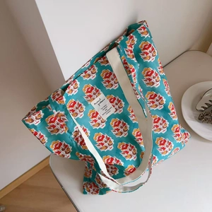 Teal vintage floral canvas tote bag with retro Indian print and white shoulder straps