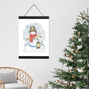 Detail of wooden magnetic hanger with festive watercolor snowman poster in home setting