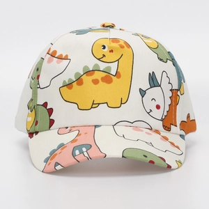 Detail of white kids baseball cap featuring colorful all-over cartoon dinosaur prints