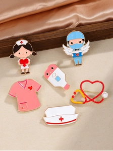 Close-up of colorful enamel medical brooches with nurse, doctor, and stethoscope designs